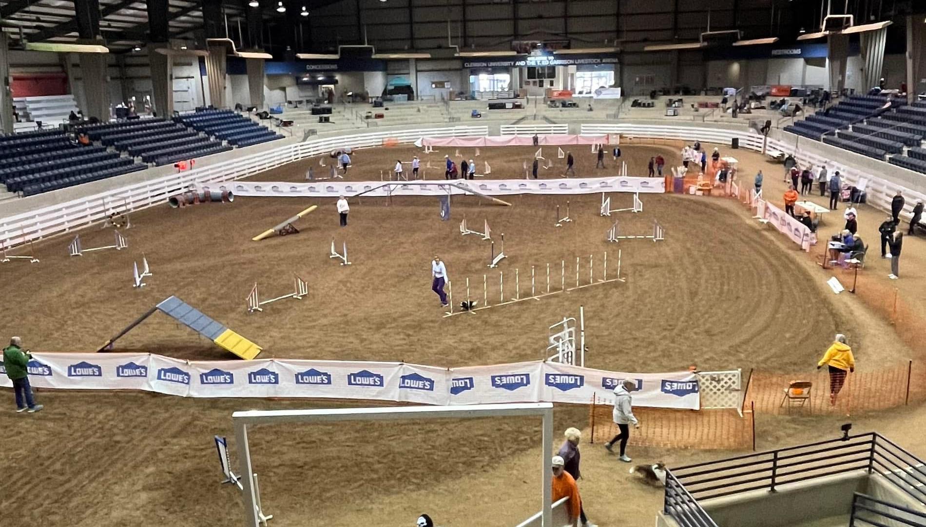 Agility rings set on the dirt floor inside T. Ed Garrison Arena